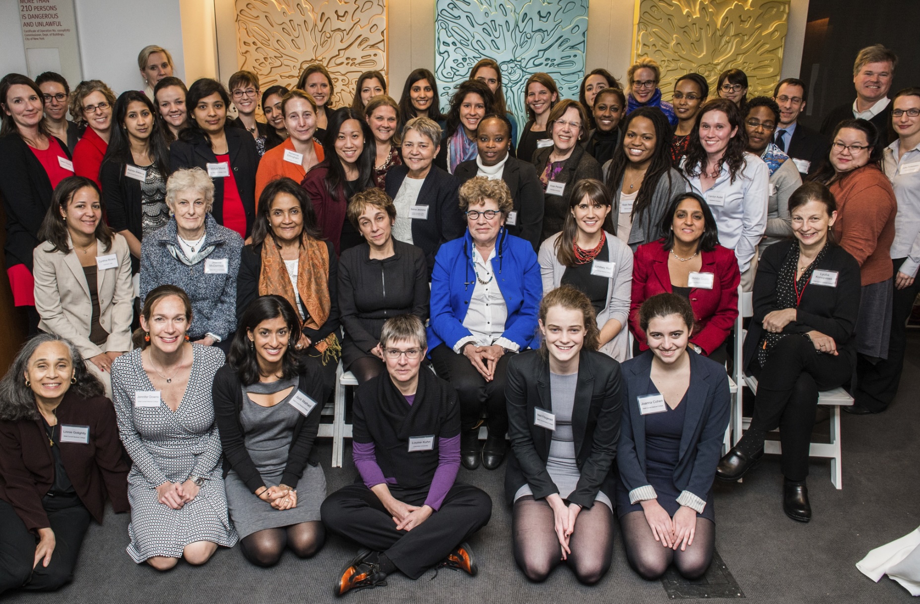 Faculty posed with attendees at the first Women in Global Health symposium