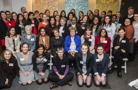 Faculty posed with attendees at the first Women in Global Health symposium